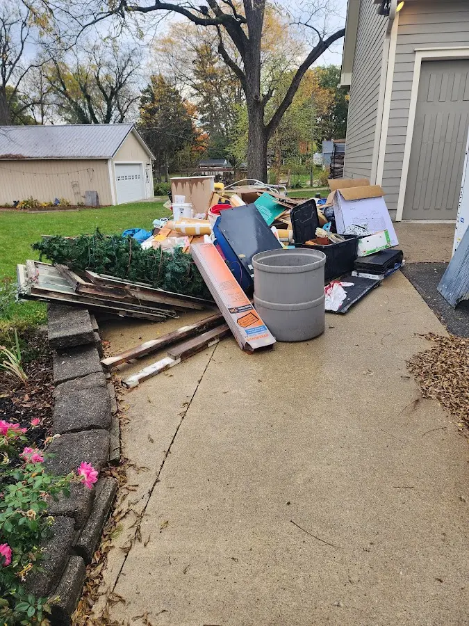 Dumpster being loaded with debris for Commercial Dumpster Rental in Kenton